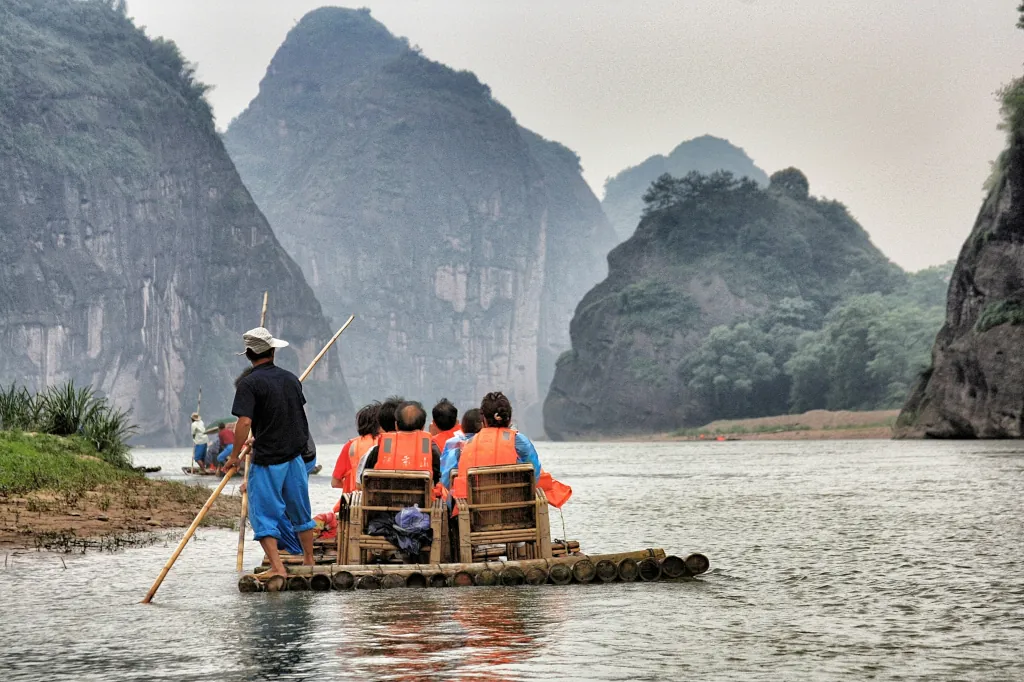 Group of people on wooden raft